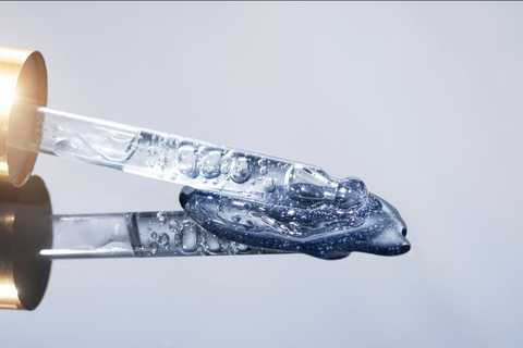 Macro shot of a precision dropper releasing a measured drop
